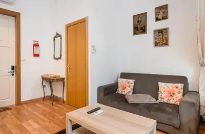 a living room with a couch and a table at Cimo Apartments - Center Porto in Porto