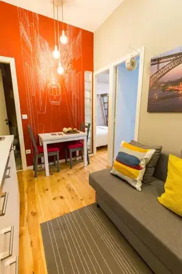 a living room with a couch and a table at Downtown Porto Twins II - City Center in Porto