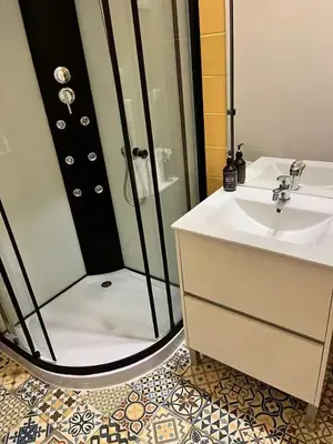 a bathroom with a shower and a sink at Downtown Porto Twins II - City Center in Porto