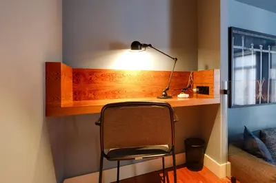 a desk with a chair and a lamp on it at Porto Heritage Balcony Apartment in Porto