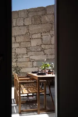 a wooden table with a television on top of it at GuestReady - A Hidden Oasis in the Center of Porto in Porto