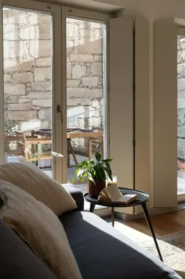 a living room with a couch and a table at GuestReady - A Hidden Oasis in the Center of Porto in Porto