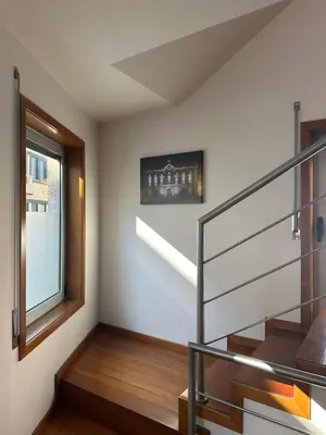 a staircase in a house with a window at Burnay Porto Suites in Porto