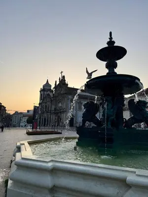 a fountain in the middle of a city at Historic Porto Flat I Balcony & Views by MyMoradia in Porto
