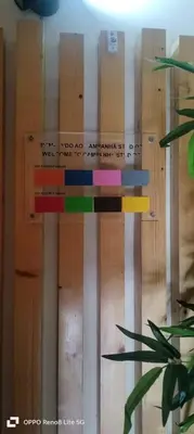 a wooden wall with a sign on it at Pink Yellow Porto Apart in Porto