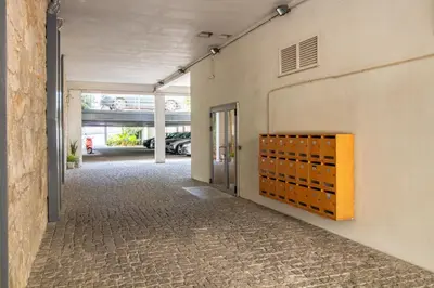an empty parking garage with an open door at Bright 1BR with Parking in Bolhão by LovelyStay in Porto