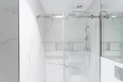 a bathroom with a shower with a glass door at GuestReady - Music Scale Studios in Porto