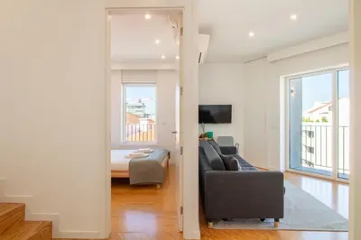a living room with a couch and a bed at Morro Flat w Terrace by LovelyStay in Vila Nova de Gaia