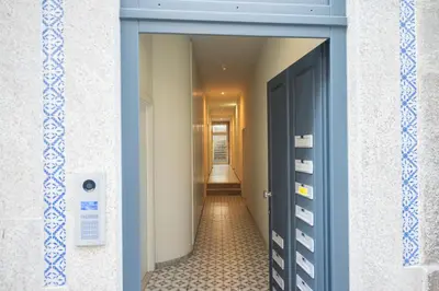 a hallway with a blue door and a hallway with a hallway at Luxury Style 20 with AC Downtown Porto near Metro in Porto