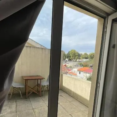 a view from a window of a balcony with a table at Blue Orange Porto Apart in Porto