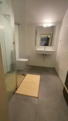 a bathroom with a shower and a sink and a mirror at Gray Red Porto Apart in Porto