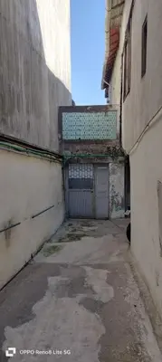 an alley with a garage and a building at Porto Bonfim suites in Porto