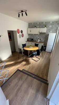 a dining room and kitchen with a table and chairs at Porto Bonfim suites in Porto