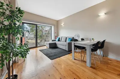 a living room with a table and a couch at GuestReady - Peaceful retreat in Porto in Porto