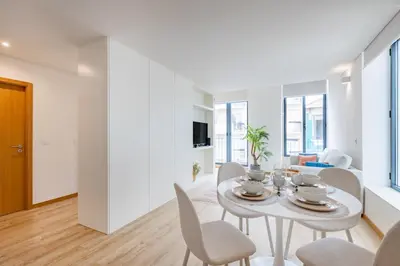 a room with a white closet and a table at Urban Style in Bonfim | Porto in Porto