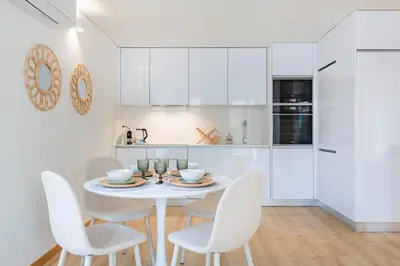 a living room with a white couch and a table at Urban Style in Bonfim | Porto in Porto