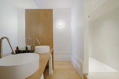 a bathroom with two sinks and a tub at City Retreat by Reframe stay in Porto in Porto