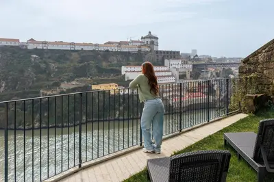 a view of a river with a bridge in the background at Miradouro River Views & Patio by PortoCityHosts in Porto