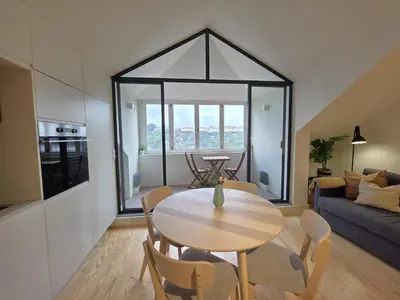 a bathroom with a toilet and a glass shower at Miradouro River Views & Patio by PortoCityHosts in Porto