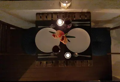 a table with three wine glasses and a flower on it at Sweet apartment in Porto in Porto