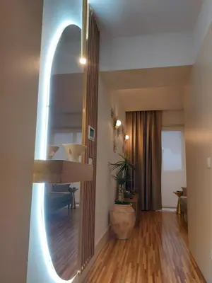a hallway with a mirror in a living room at Oporto Hideaway 3 - Poveiros Square Balcony in Porto