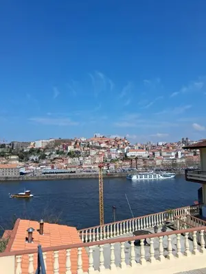 a view of a river with boats in a city at Douro Villa 3 - Best View in Town in Vila Nova de Gaia