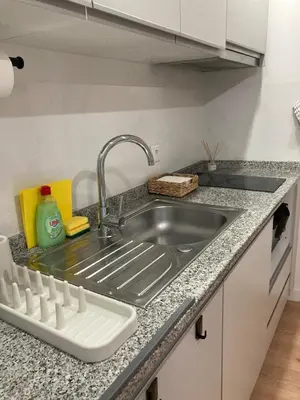 a kitchen counter with a sink in a kitchen at Douro Villa 3 - Best View in Town in Vila Nova de Gaia