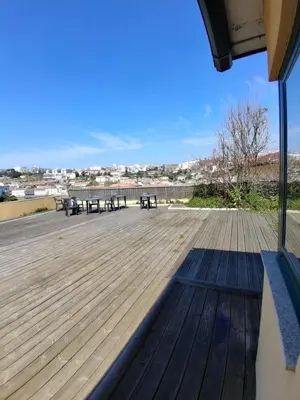 a large deck with benches and tables on it at Douro Villa 3 - Best View in Town in Vila Nova de Gaia