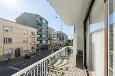 a view of a city street from a balcony at Urban Terrace & Stylish Living Spaces by HostWise in Porto