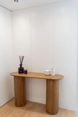 a wooden table in a room with white walls at Urban Terrace & Stylish Living Spaces by HostWise in Porto