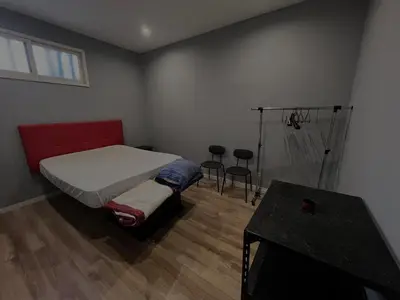 a small bedroom with a bed and a table at Casa Carvalho Guest House Porto in Porto