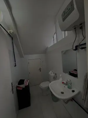 a bathroom with a sink and a toilet at Casa Carvalho Guest House Porto in Porto