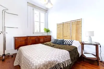 a bedroom with a large bed and a window at Ai Porto! Family 3 in Porto