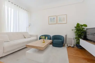 a living room with a couch and a coffee table at Liiiving in Porto - Lovely Stylish Apartment in Porto