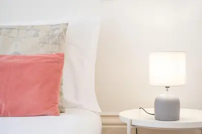 a bedroom with a bed and a tv and a table at Noa Porto by Bom Porto Apartments in Porto