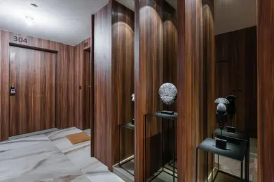 a room with wooden walls and a bed in it at GuestReady – City Center Apartment with Balcony in Porto