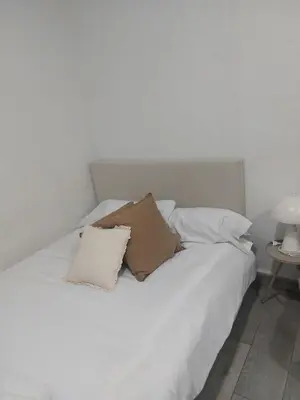 a white bed with two pillows on top of it at PTLC225 Apartament T1 Porto Centro in Porto