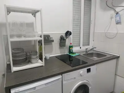 a kitchen with a sink and a washing machine at PTLC225 Apartament T1 Porto Centro in Porto