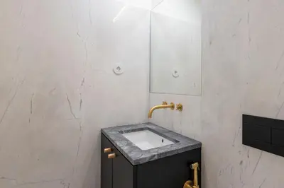 a bathroom with a sink and a mirror at ApartmentsPorto - Alexandre Braga in Porto