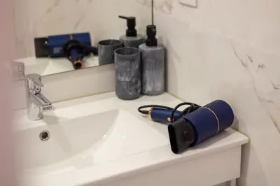 a bathroom counter with a sink and a mirror at Santa Catarina Studio w Patio by LovelyStay in Porto