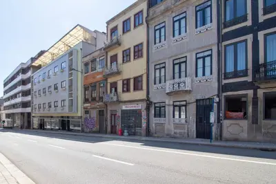 an empty street in a city with buildings at Santa Catarina Studio w Patio by LovelyStay in Porto