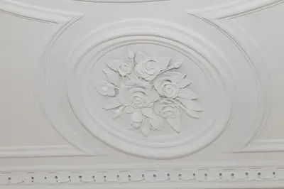 a white ceiling with a carving of flowers on it at Your Base Porto Art District in Porto
