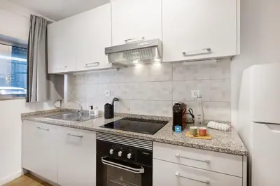 a bathroom with a shower and a sink and a toilet at Smart Stay in Gaia | Cozy & Work-Ready in Vila Nova de Gaia