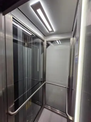 an empty elevator in a building with a ceiling at Alma Porto in Porto