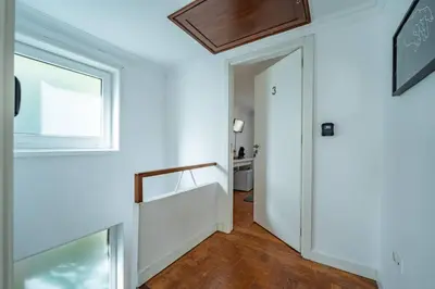 a white room with a desk and a chair at Oporto Maria Pia Suite 3 in Porto