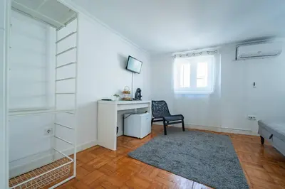 a dining room with a table and two chairs at Oporto Maria Pia Suite 3 in Porto