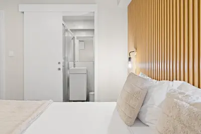 a bedroom with a white bed with white pillows at GuestReady - Modern Porto's retreat in Porto