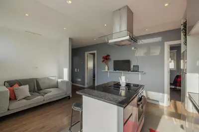 a kitchen and living room with a couch at Your Home at Porto in Porto