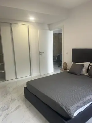 a bedroom with a large bed and sliding glass doors at Candal house in Vila Nova de Gaia