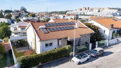 an aerial view of a house with solar panels on its roof at Home Sweet Home in Porto